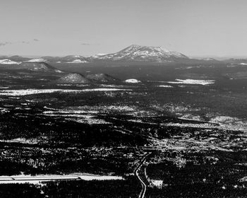 Aerial view of snowcapped mountain against sky