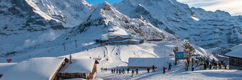 Panoramic view of people on snowcapped mountain