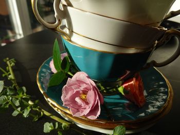 Close-up of cups stacked on saucers