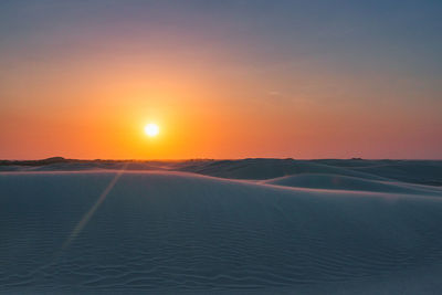 Scenic view of landscape against sky during sunset