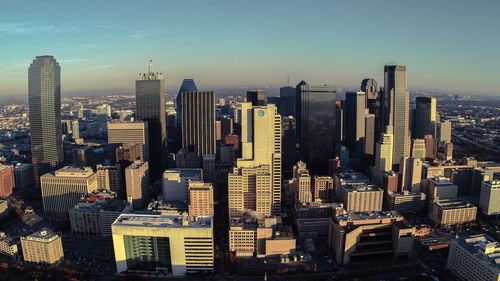 Aerial view of modern buildings in city against sky