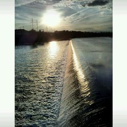 Scenic view of river at sunset