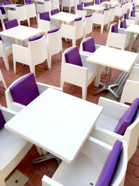 High angle view of tables and chairs arranged at restaurant