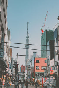 Buildings in city against clear sky