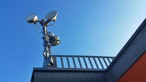 Low angle view of built structure against clear blue sky