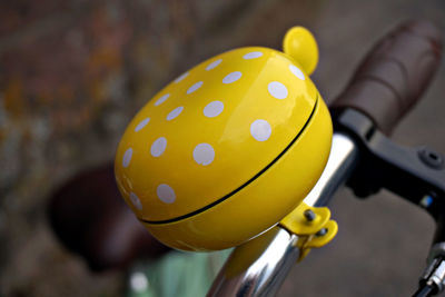 Close-up of yellow bicycle bell