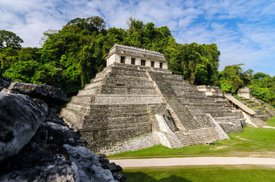 Temple of inscriptions against sky on sunny day