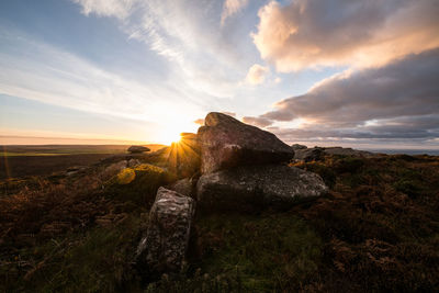 Scenic view of landscape against sky during sunset