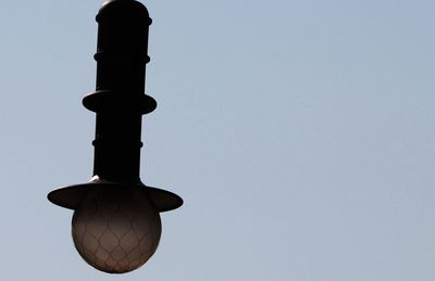 Low angle view of hanging against sky