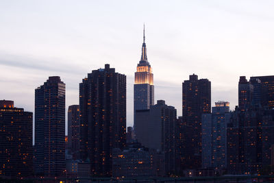 Modern buildings in city against sky