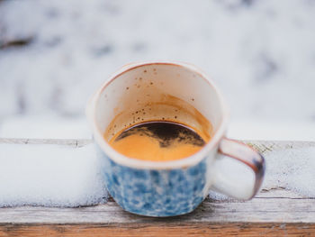 Close-up of coffee cup on table