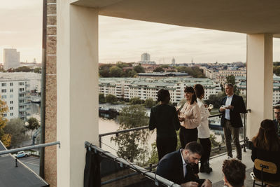 Smiling business people discussing during office party