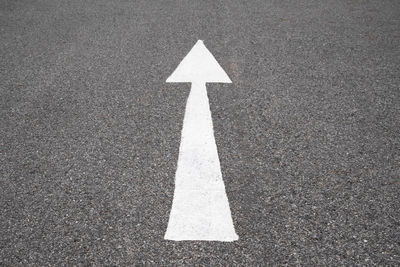 Arrow symbol on road in city