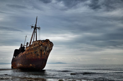 Sailboat on sea against sky