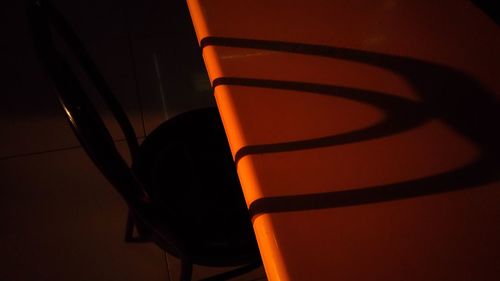 Close-up of chair in illuminated room
