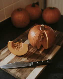 High angle view of pumpkins on cutting board