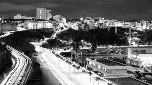 High angle view of city street and buildings at night