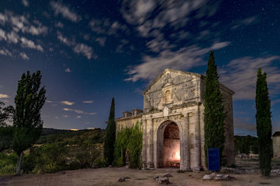 Old building against sky at night