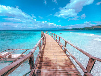 Pier over sea against sky