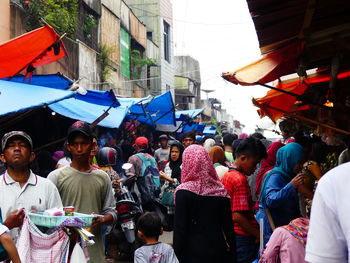 Group of people at market in city