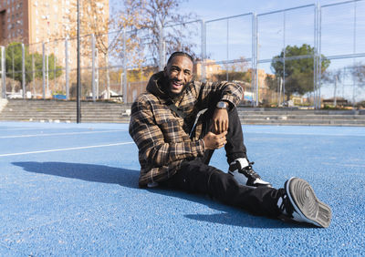 Young man sitting outdoors