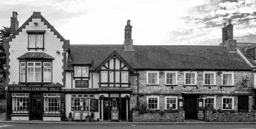 The bugle coaching inn against sky in city