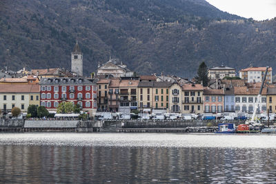 Town by river and buildings in city