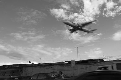 Low angle view of airplane flying in sky