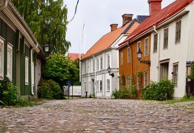 Street amidst buildings against sky