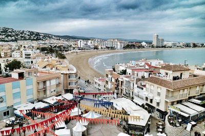 High angle view of townscape by sea