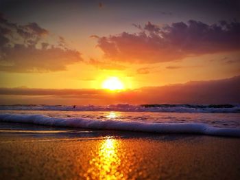 Scenic view of sea at sunset