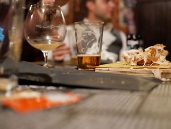 Close-up of beer glass on table