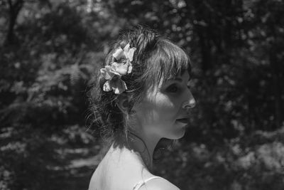 Portrait of a young woman looking away