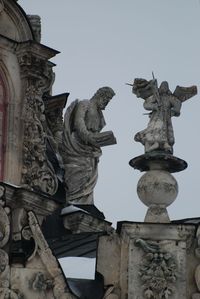 Low angle view of angel statue against clear sky