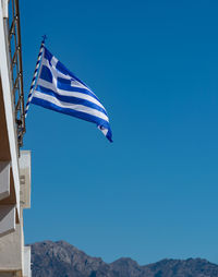 Greece flag on a building in kardamaina kos