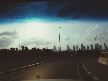 City street against cloudy sky