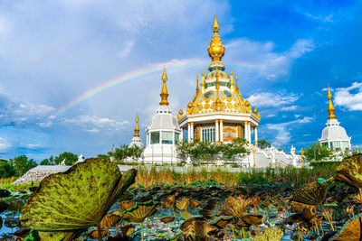 View of temple building against cloudy sky