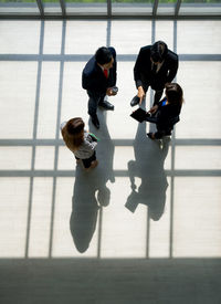 High angle view of people standing on floor