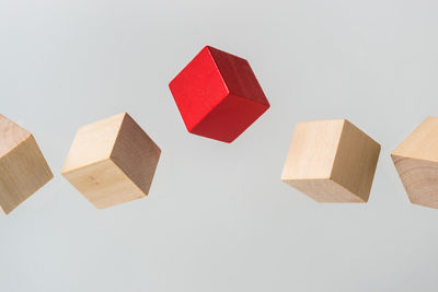 High angle view of toys on table against white background