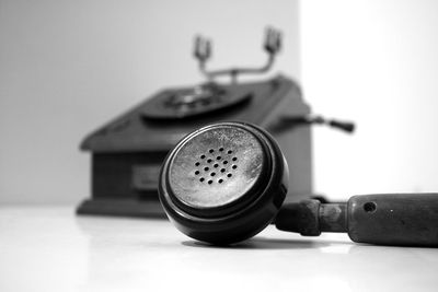 Close-up of rotary phone on white background