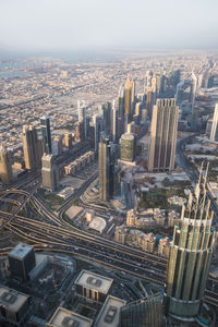 High angle view of modern buildings in city against sky