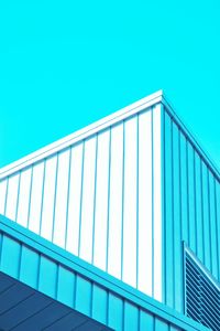 Low angle view of building against clear blue sky