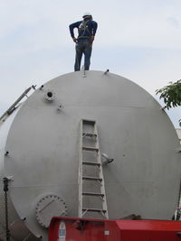 Low angle view of man standing against sky