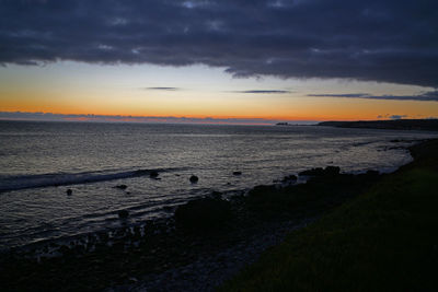 Scenic view of sea at sunset