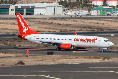 View of airplane at airport runway