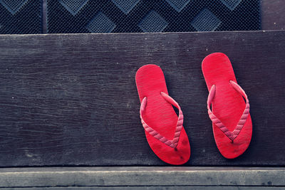 Directly above shot of red flip-flops on steps