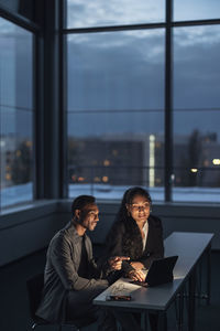 Business people working late in office