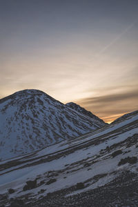 Scenic view of mountains against sky during sunset