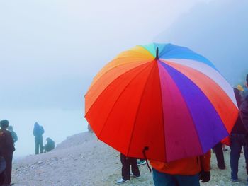 Low section of people against clear sky