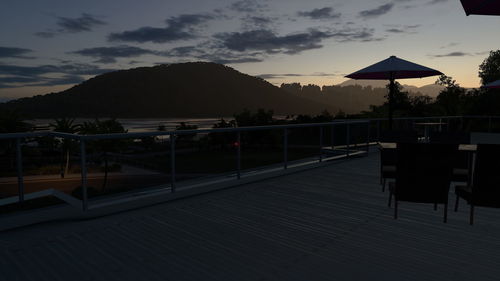 Scenic view of swimming pool against sky during sunset